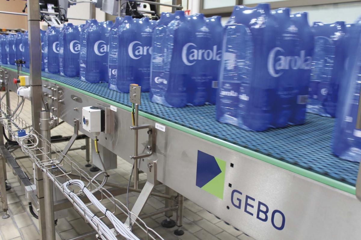 Carola mineral water pack on conveyor