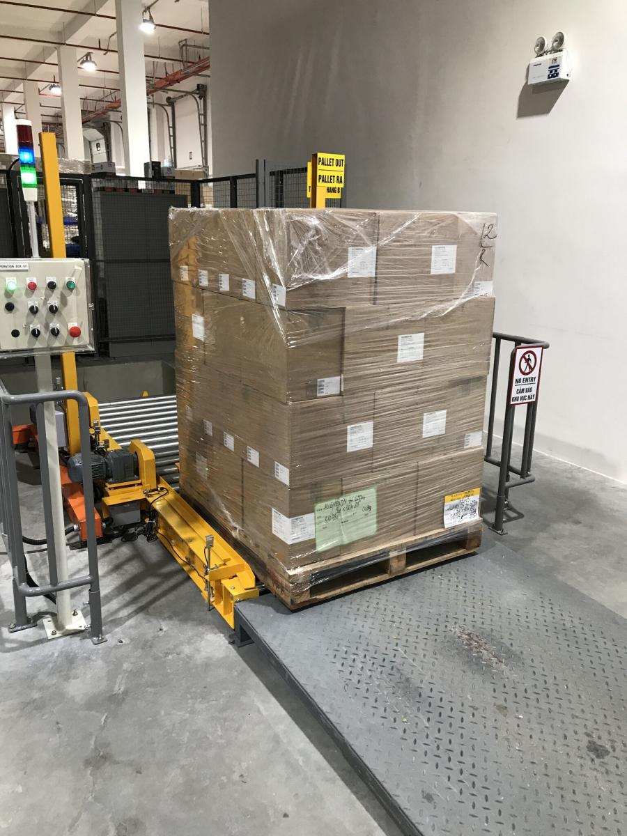 Loaded pallet on the conveyor - Consoveyo Singapore