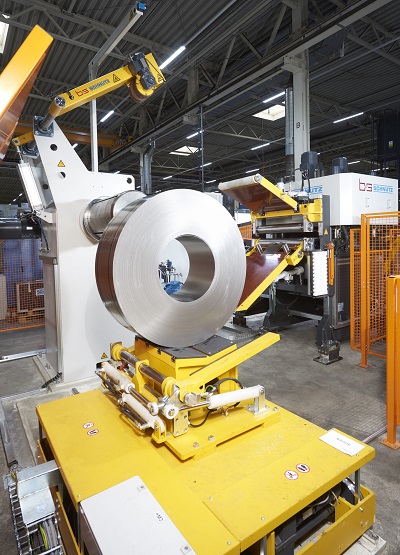 Coils are pushed on to the decoiler by the coil lift truck