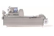 Compact machine for vacuum skin packs