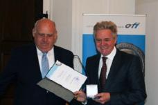 Dr. Werner Wittmann presented with the H.F. Mark medal by OFI Institute