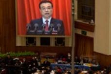 China revises growth target, initiates more reforms