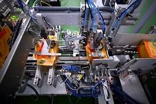 High-speed wrap-around case packer