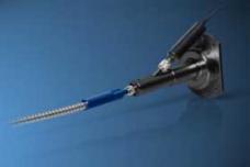 Fiber coupler simultaneously transmits CO2 laser beam, pilot beam